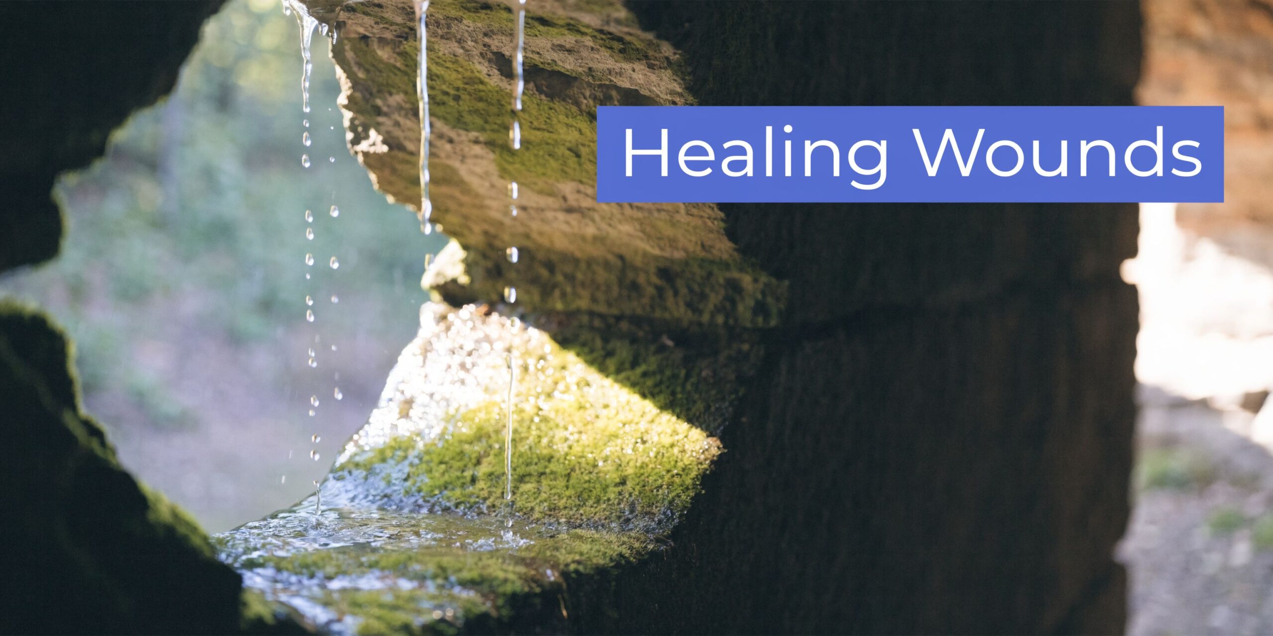 water dripping on a hollow rock with the words "healing wounds" written on the image representing the healing in recovery treatment