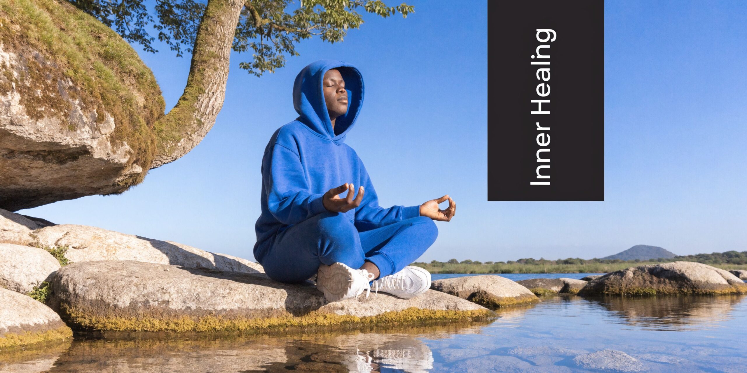 young man sitting and meditating on his recovery journey looking at the words Inner Healing