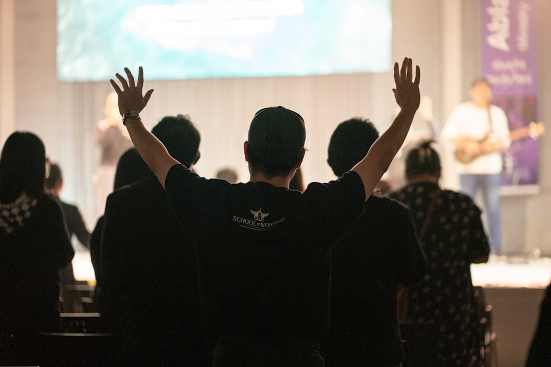 Christian addiction aftercare program person in prayer looking toward bright horizon hope restoration renewal